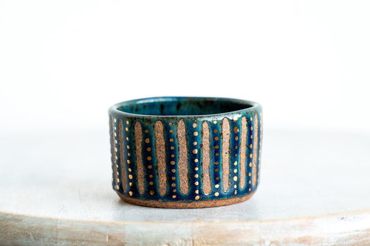 gold speckled blue stoneware vessel