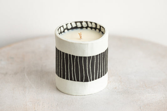 black striped exterior with white blocked interior porcelain candle