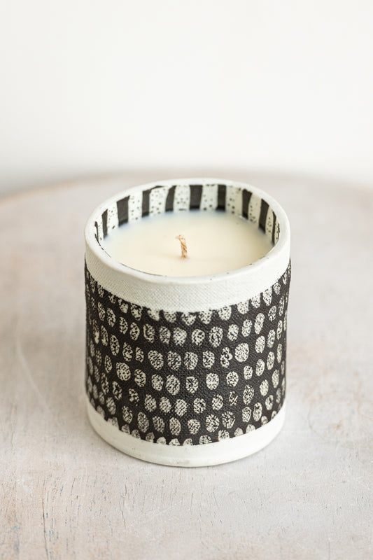 white blocked exterior with black striped interior porcelain candle